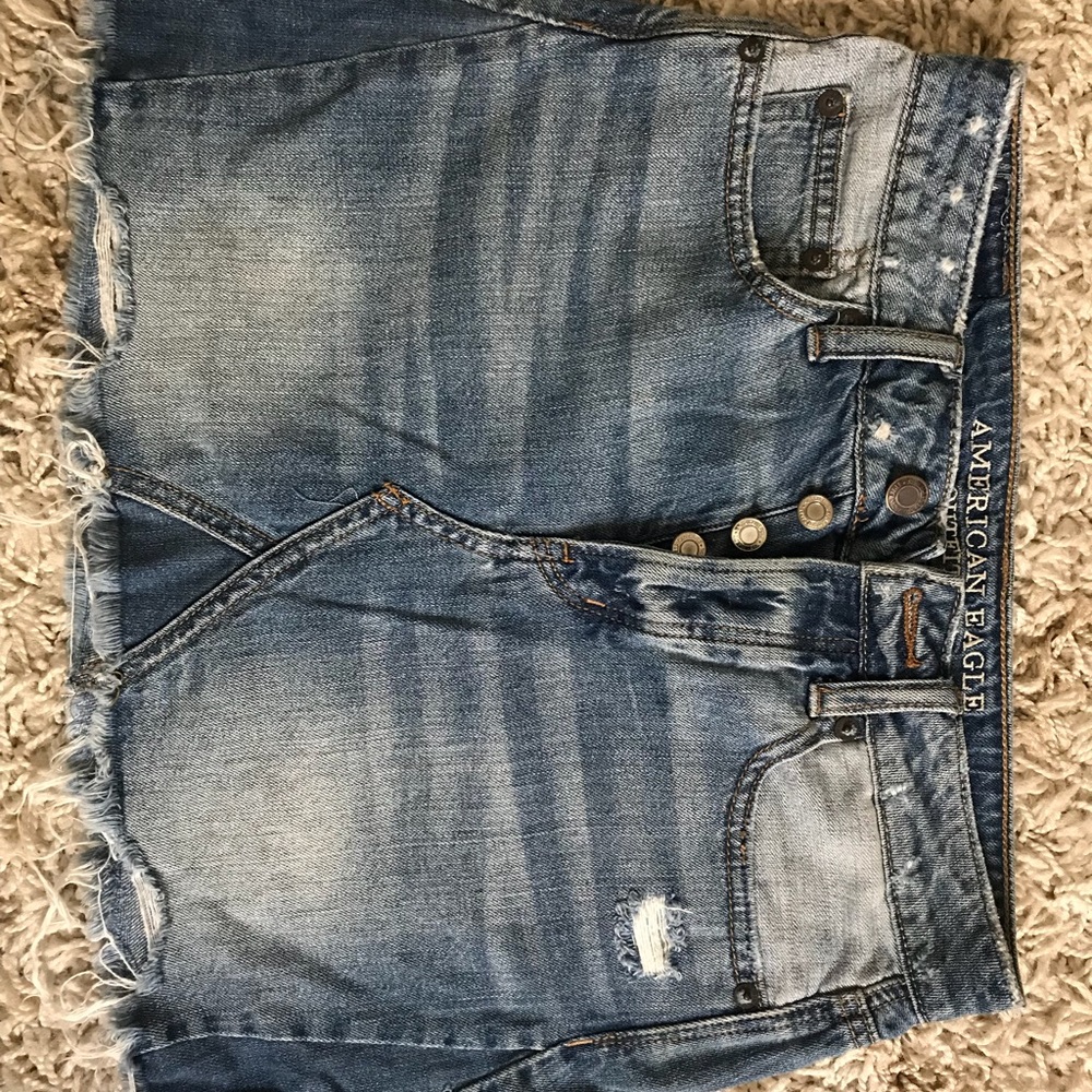 High waisted denim worn skirt